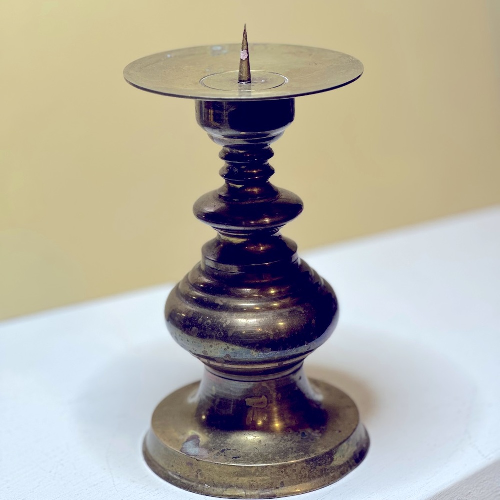 Brass candle holder Vintage patina. Weighted, 4x7”